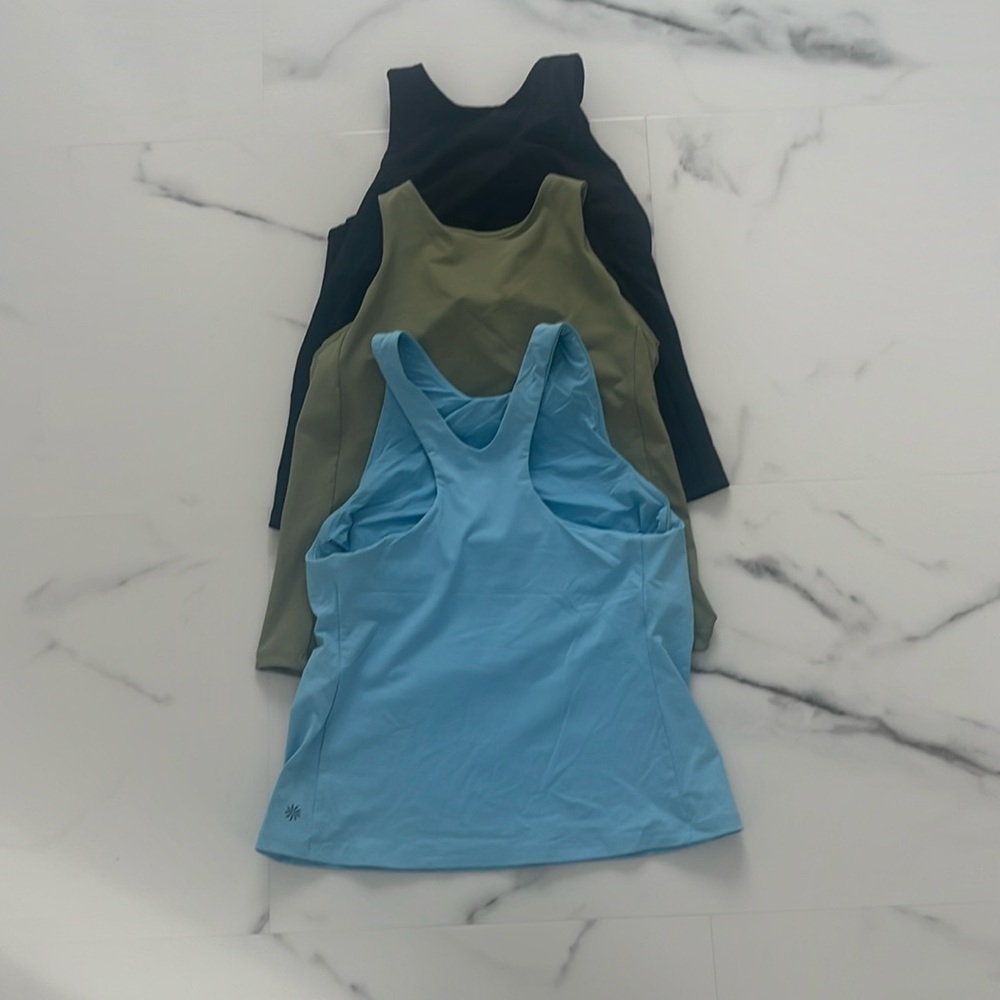3 medium Athleta Conscious tanks with built in bra
